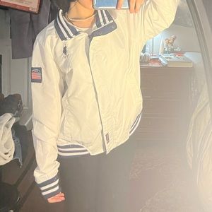 White polo windbreaker with navy blue detailing